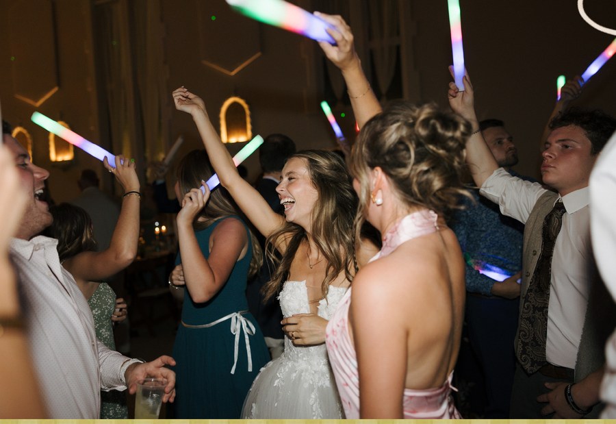 Wedding guests dancing with foam glow sticks