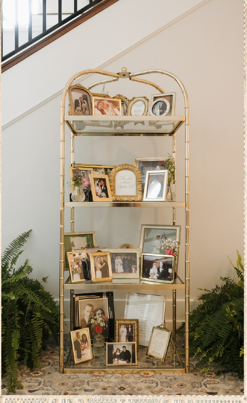 Gold shelving unit displaying framed family photos