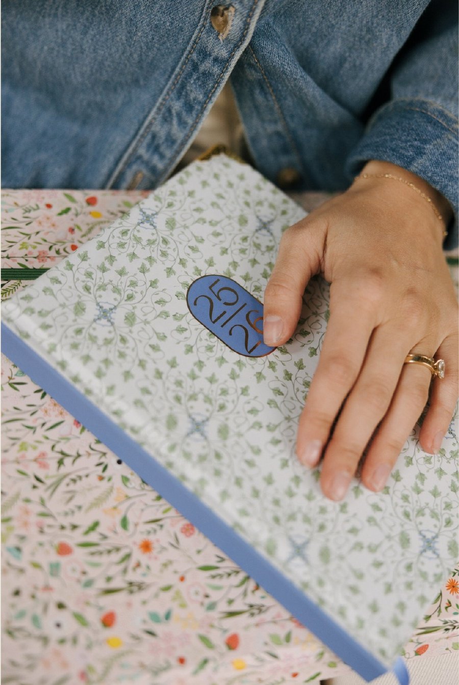 Wedding planner reviewing a floral planning notebook